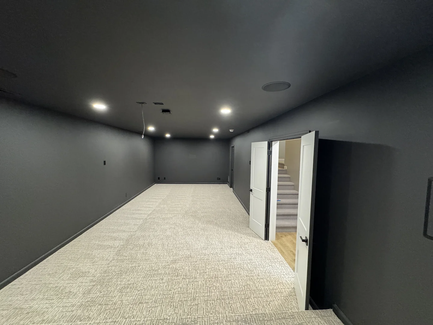 Finished basement with entertainment area in Omaha home