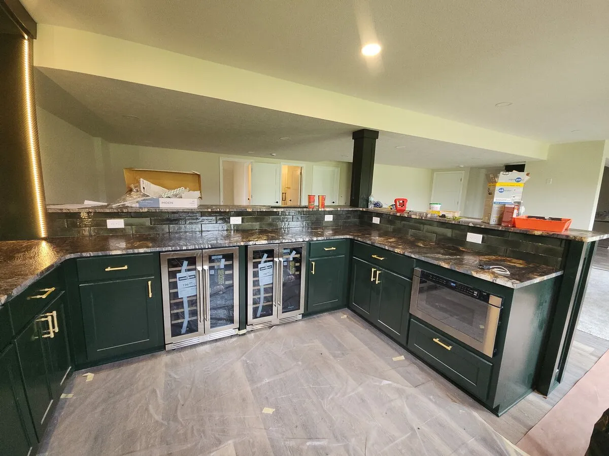 Contemporary kitchen design featuring new appliances and open layout